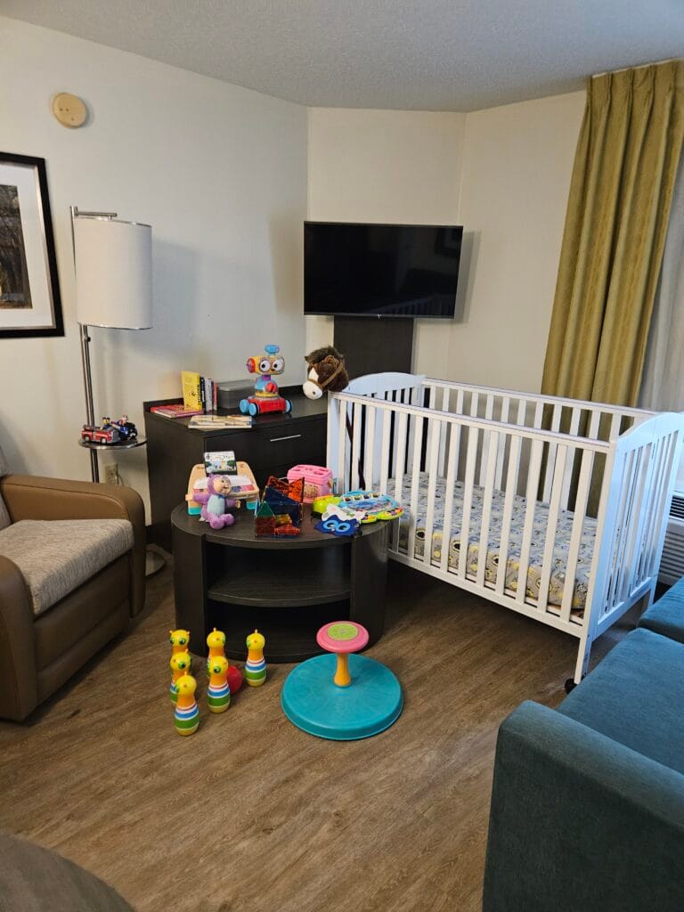 Baby gear set up in a hotel room