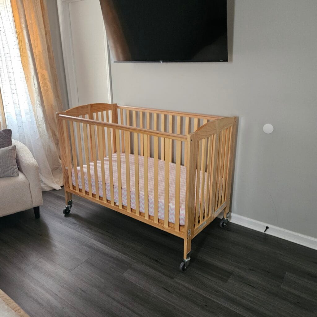 Full-size Crib Set up in bedroom
